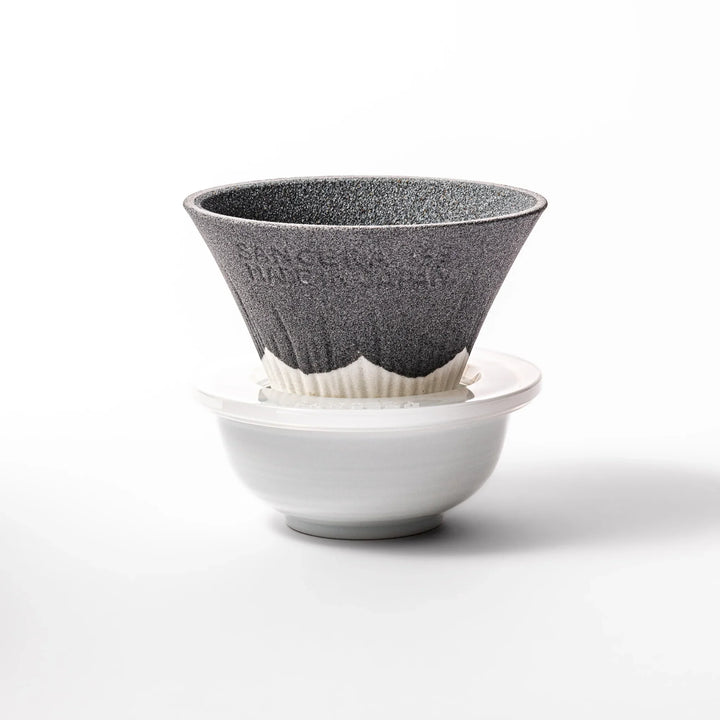 Black Mount Fuji ceramic coffee filter with snowy peak design, handcrafted in Japan for reusable pour-over brewing and stylish kitchen decor.