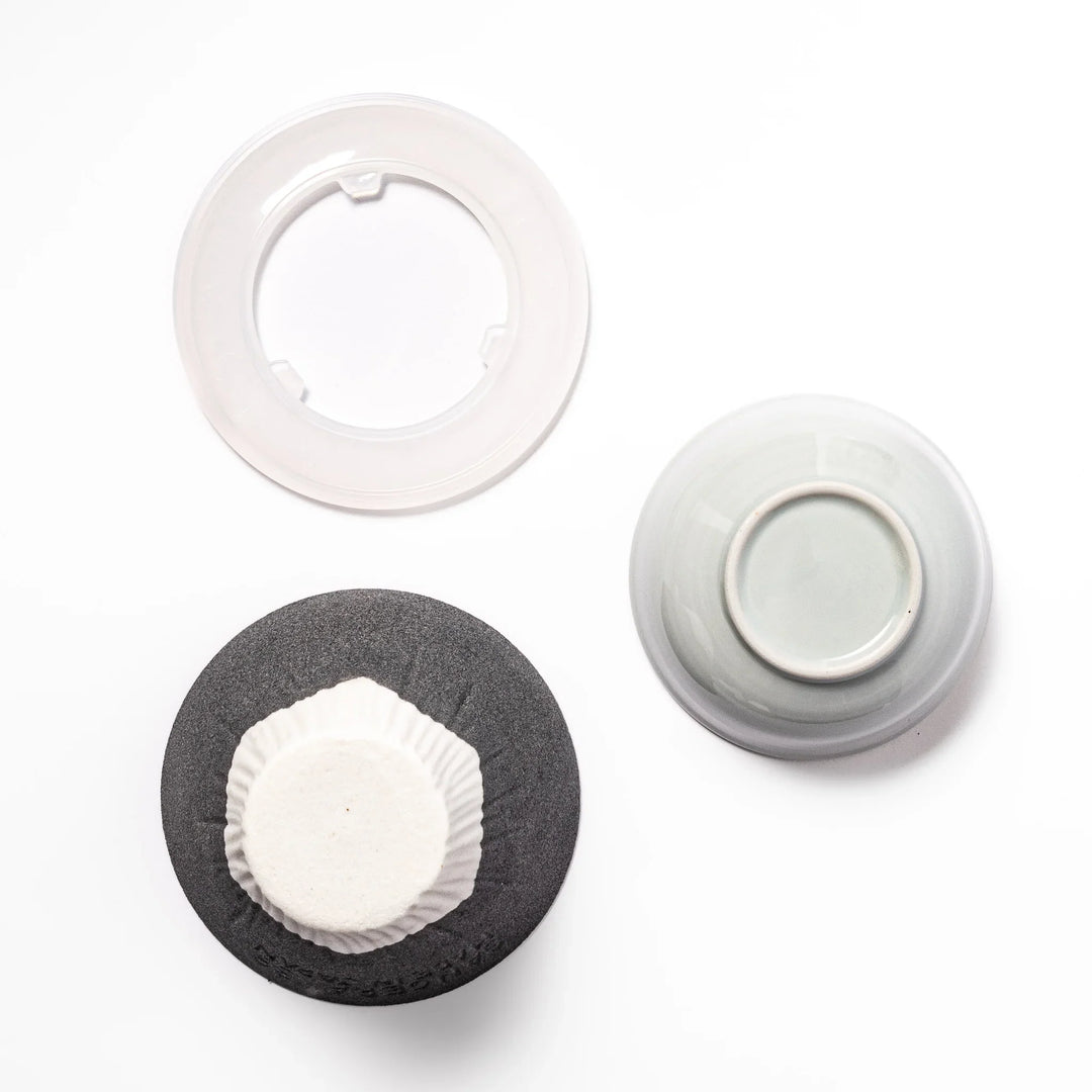 Black Mount Fuji ceramic coffee filter with snowy peak design, handcrafted in Japan for reusable pour-over brewing and stylish kitchen decor.