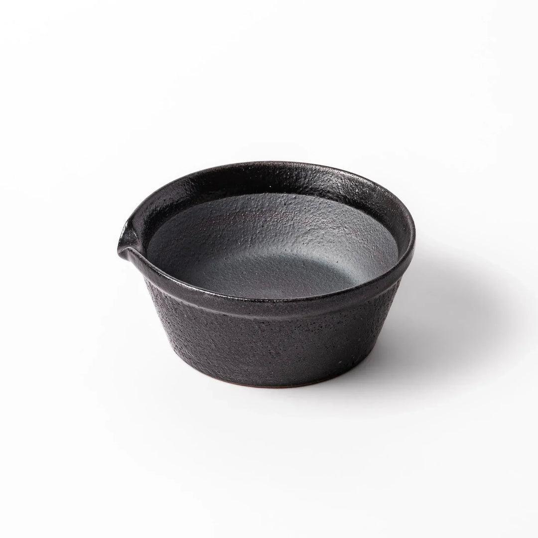 Black ceramic suribachi mortar bowl with a smooth interior and spout, perfect for grinding or mixing without grooves for easy cleanup.