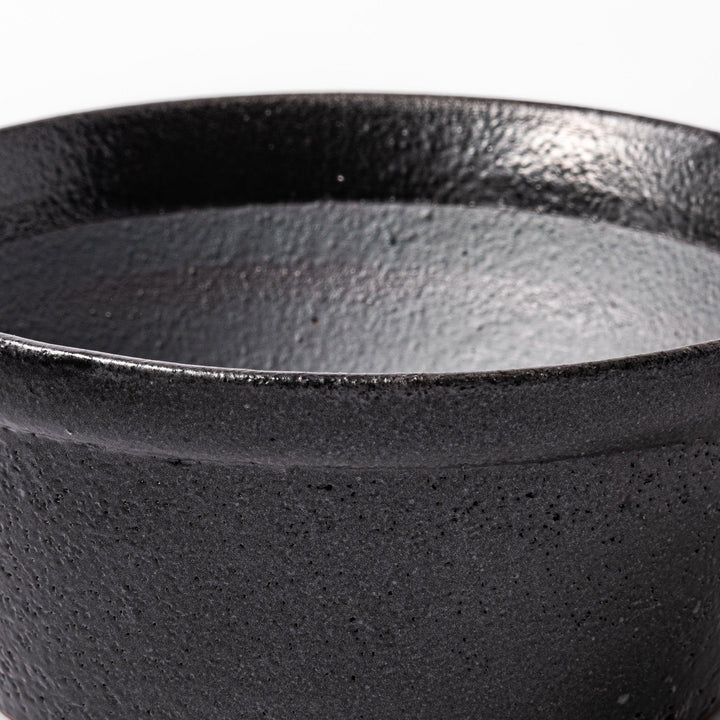 Black ceramic suribachi mortar bowl with a smooth interior and spout, perfect for grinding or mixing without grooves for easy cleanup.