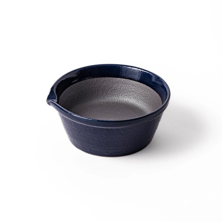 Deep blue ceramic suribachi mortar bowl with a smooth interior and spout, ideal for grinding and serving sauces or dressings with ease.