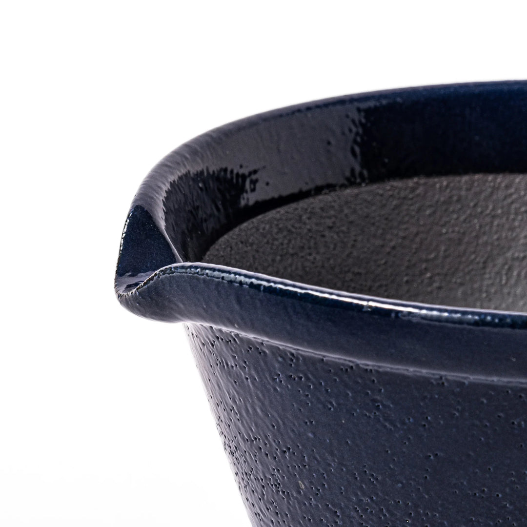 Deep blue ceramic suribachi mortar bowl with a smooth interior and spout, ideal for grinding and serving sauces or dressings with ease.