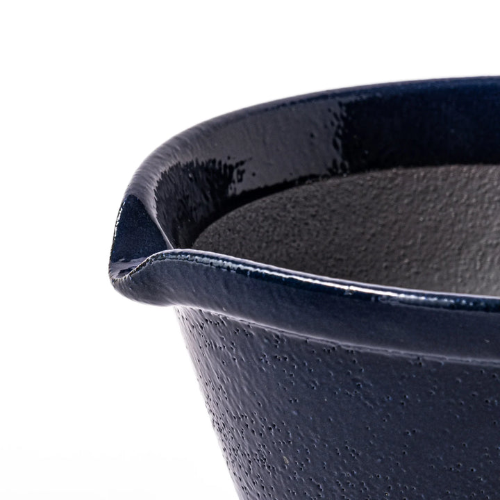 Deep blue ceramic suribachi mortar bowl with a smooth interior and spout, ideal for grinding and serving sauces or dressings with ease.