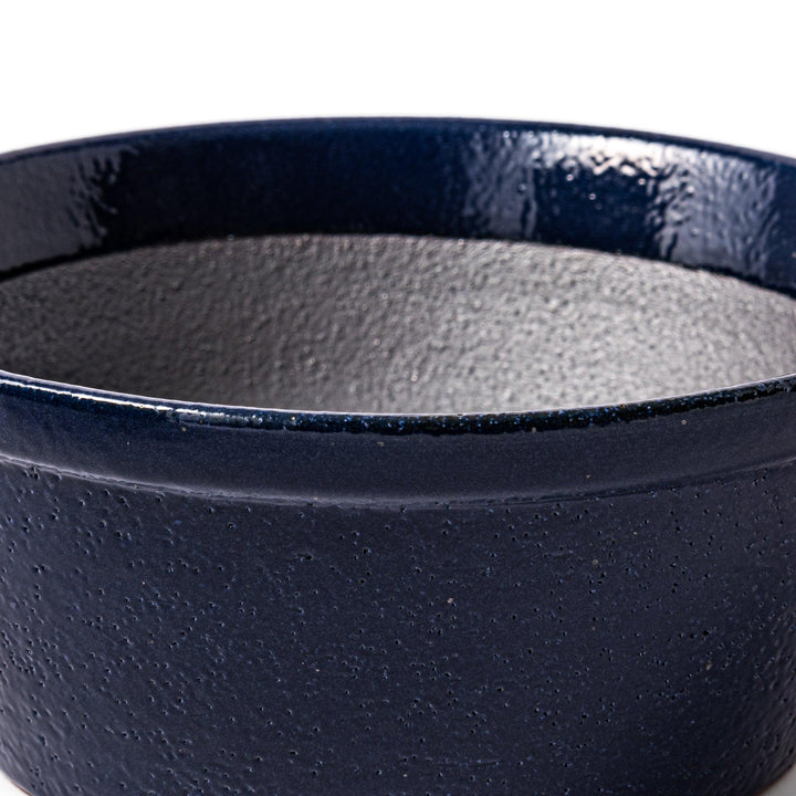 Deep blue ceramic suribachi mortar bowl with a smooth interior and spout, ideal for grinding and serving sauces or dressings with ease.