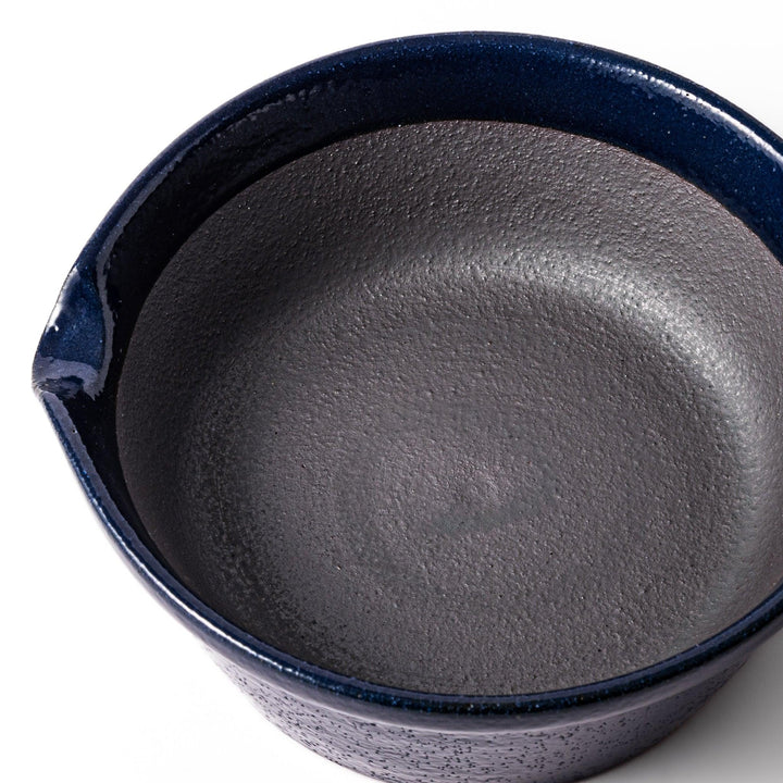 Deep blue ceramic suribachi mortar bowl with a smooth interior and spout, ideal for grinding and serving sauces or dressings with ease.