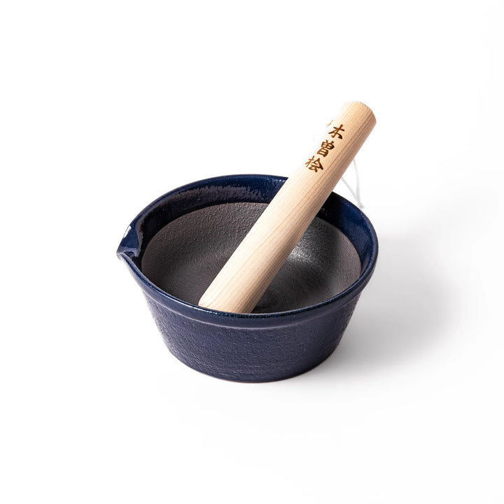 Deep blue ceramic suribachi mortar bowl with a smooth interior and spout, ideal for grinding and serving sauces or dressings with ease.