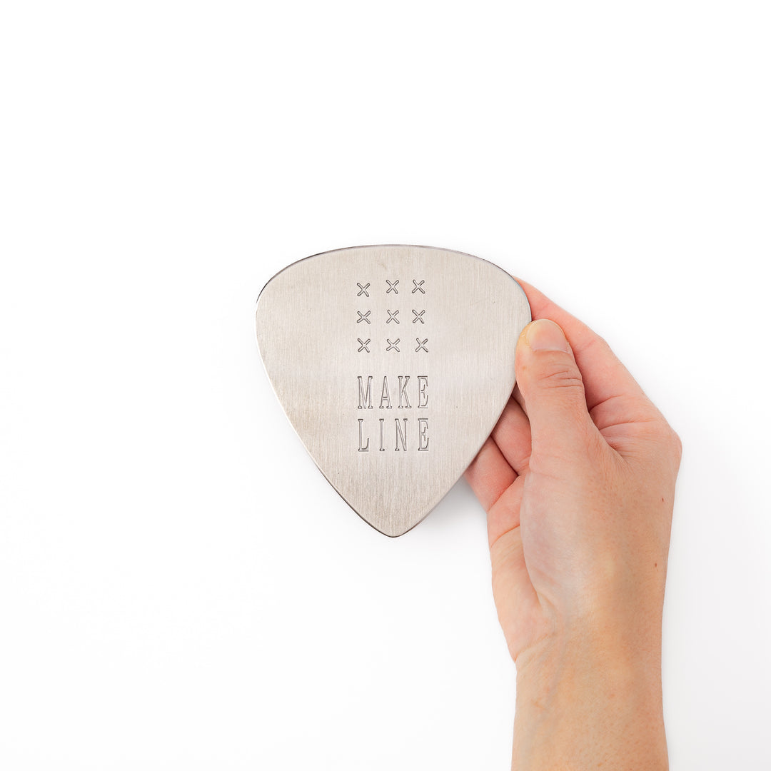 Unique guitar pick shaped stainless steel metal coaster engraved with make line text and cross patterns