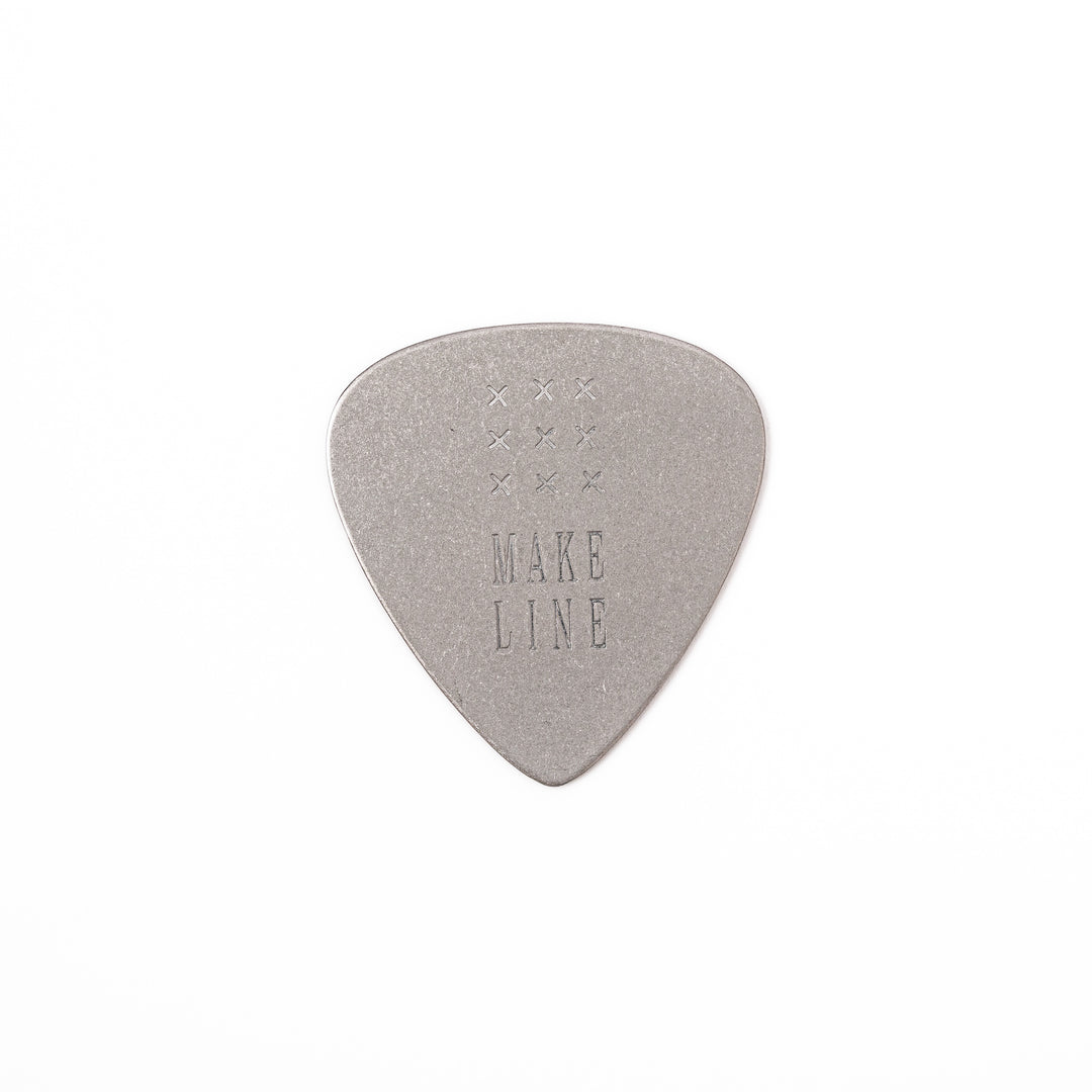 Unique guitar pick shaped metal coaster with vintage matte finish engraved with make line text and cross patterns