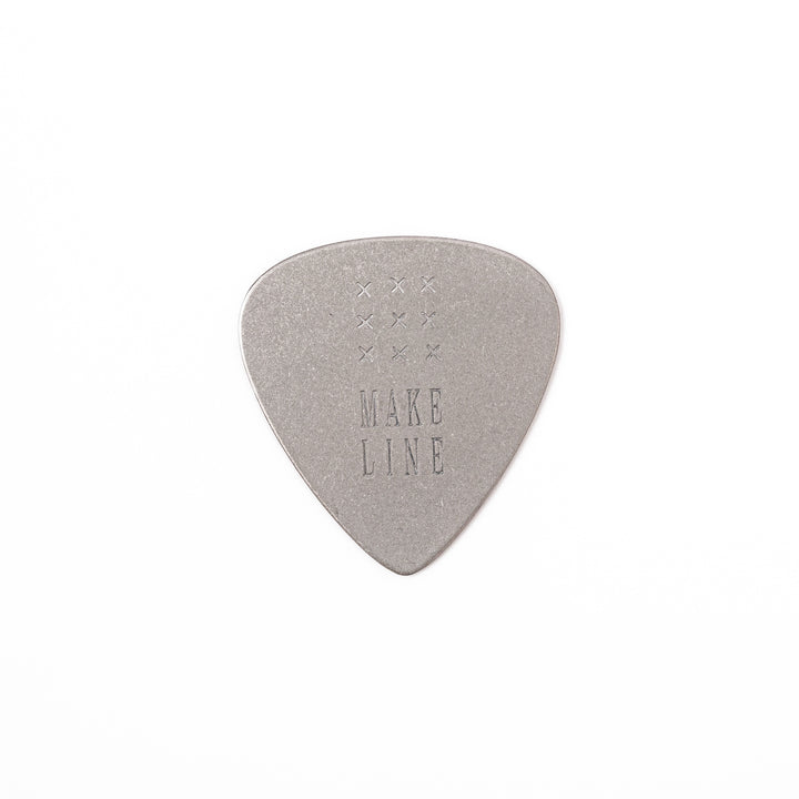 Unique guitar pick shaped metal coaster with vintage matte finish engraved with make line text and cross patterns