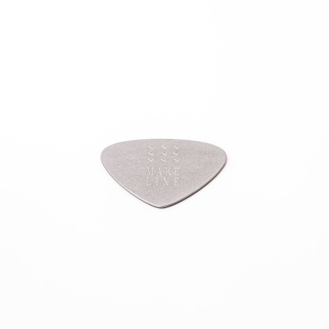 Unique guitar pick shaped metal coaster with vintage matte finish engraved with make line text and cross patterns