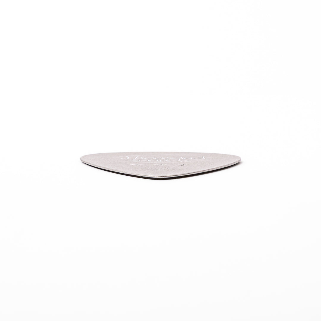 Unique guitar pick shaped metal coaster with vintage matte finish engraved with thousand sounds text and stars