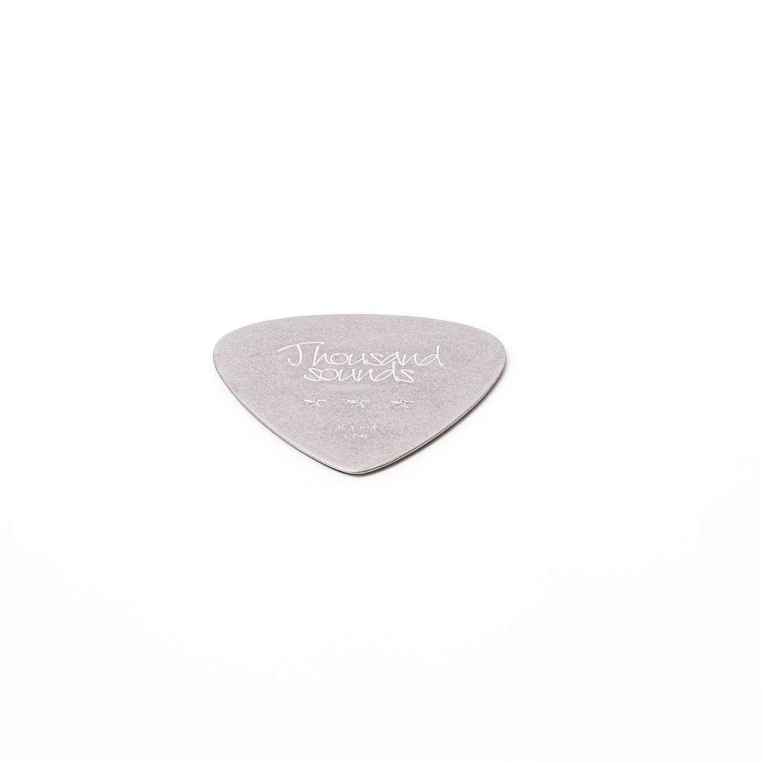 Unique guitar pick shaped metal coaster with vintage matte finish engraved with thousand sounds text and stars