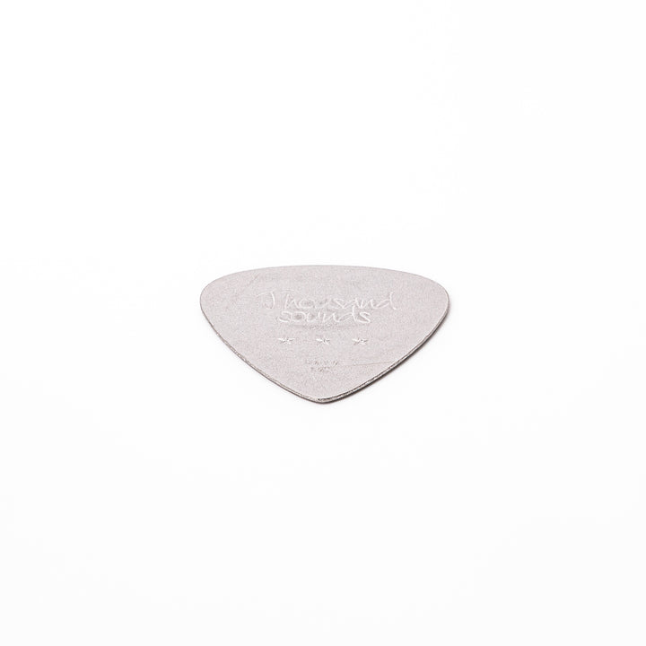 Unique guitar pick shaped metal coaster with sandblasted textured finish engraved with thousand sounds text and stars