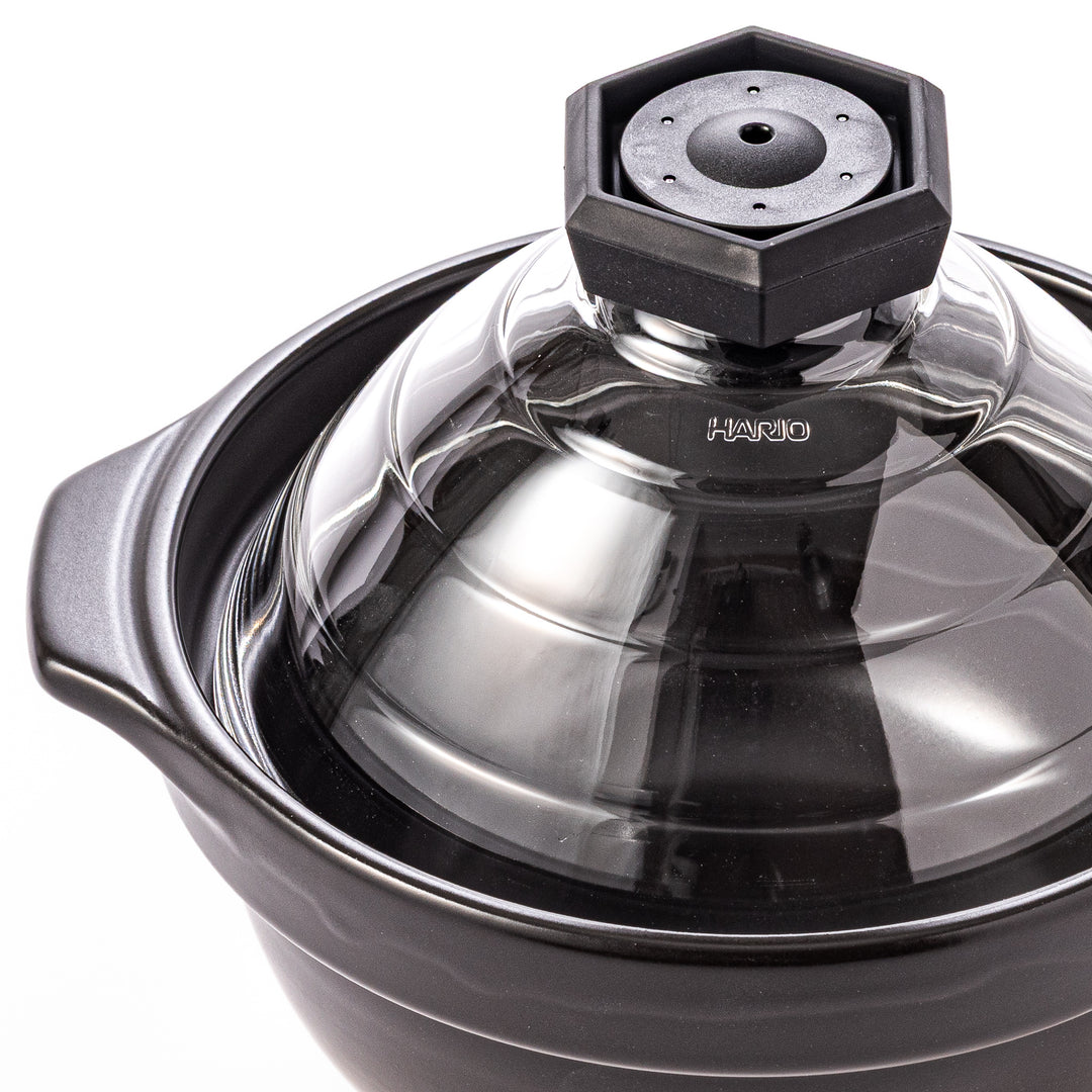 HARIO GohanGama ceramic rice cooker pot with a clear glass lid, designed for traditional Japanese stove top cooking