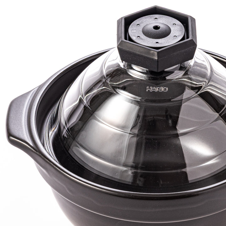 HARIO GohanGama ceramic rice cooker pot with a clear glass lid, designed for traditional Japanese stove top cooking