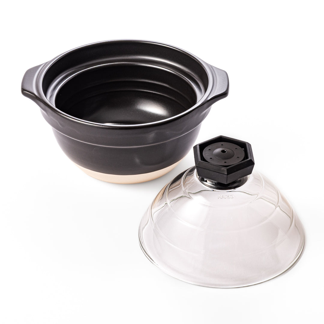 HARIO GohanGama ceramic rice cooker pot with a clear glass lid, designed for traditional Japanese stove top cooking