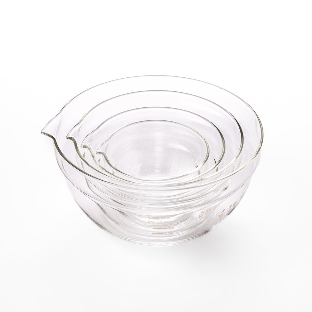 Set of four HARIO heat resistant glass mixing bowls with pour spouts, featuring various nested sizes for easy meal prep