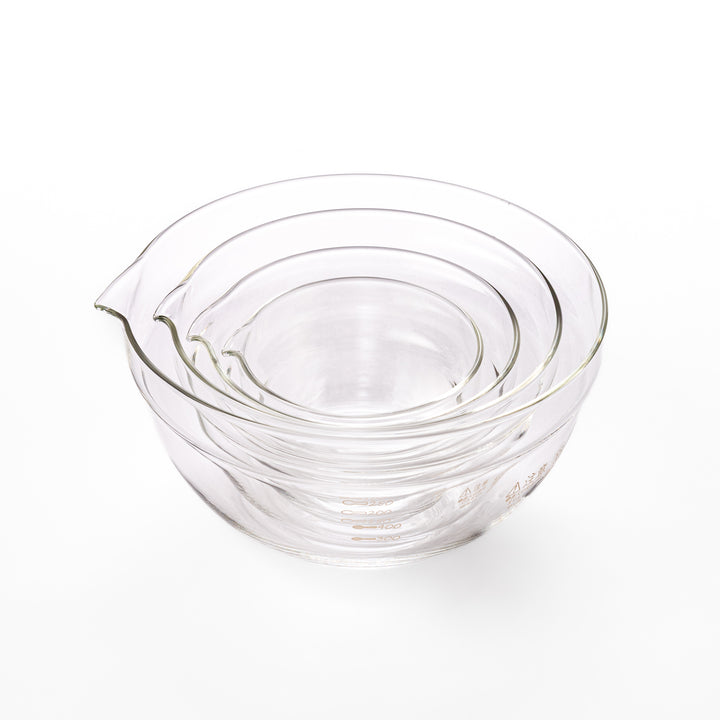Set of four HARIO heat resistant glass mixing bowls with pour spouts, featuring various nested sizes for easy meal prep
