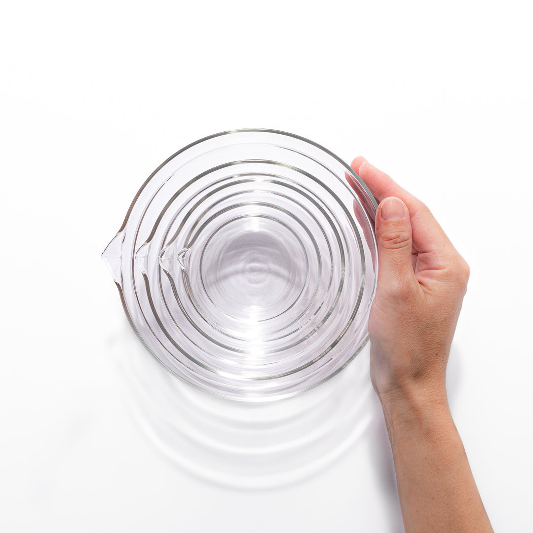 Set of four HARIO heat resistant glass mixing bowls with pour spouts, featuring various nested sizes for easy meal prep