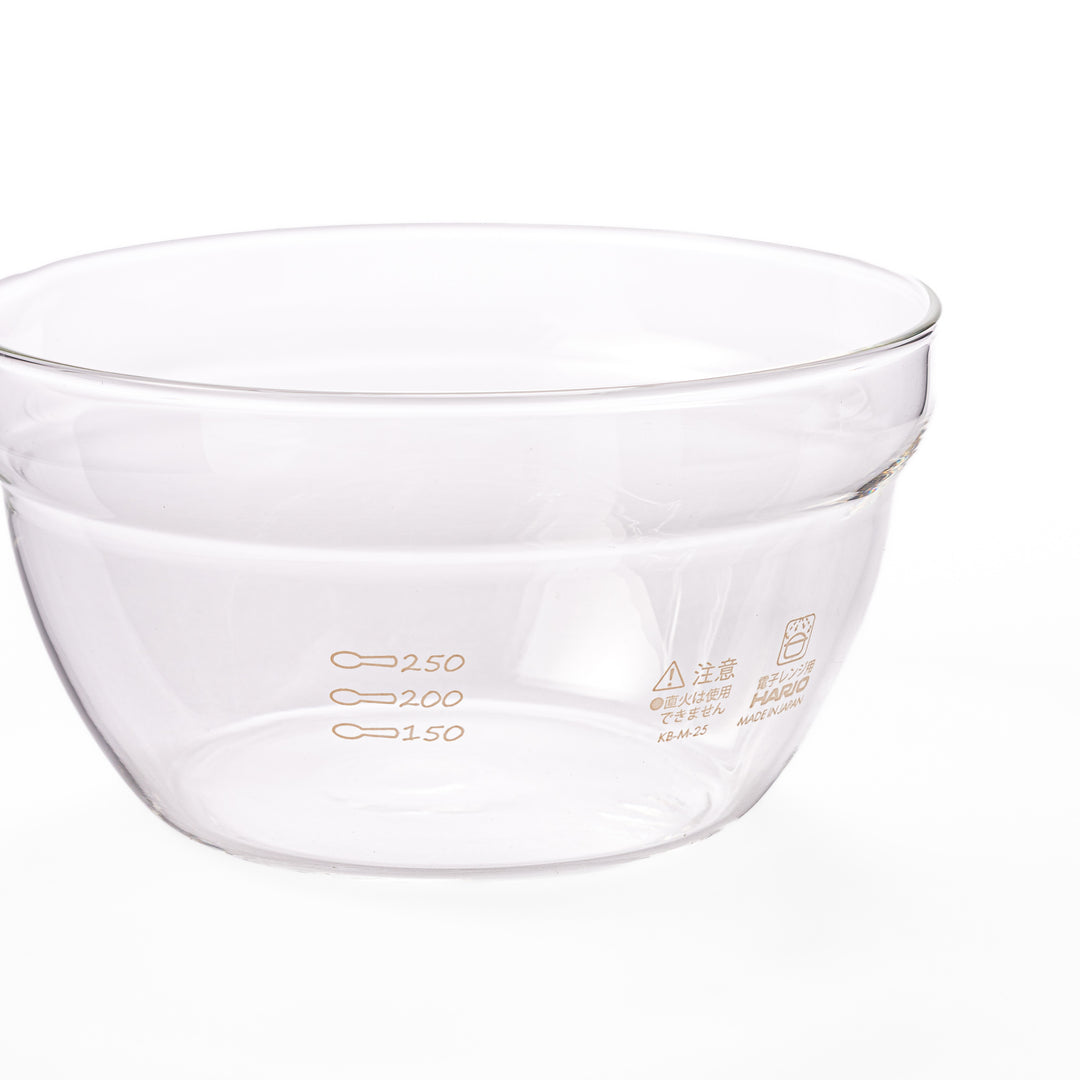 Set of four HARIO heat resistant glass mixing bowls with pour spouts, featuring various nested sizes for easy meal prep