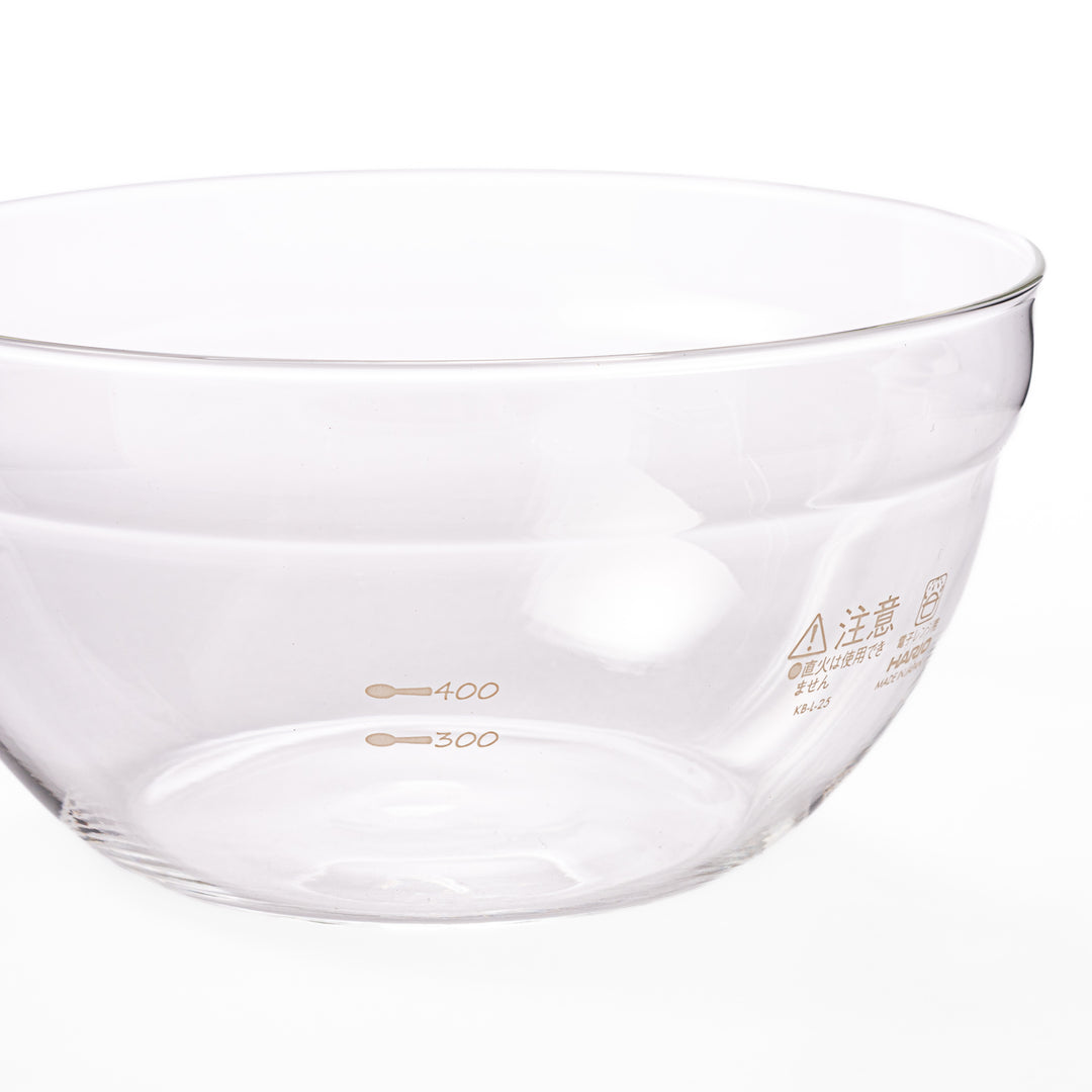 Set of four HARIO heat resistant glass mixing bowls with pour spouts, featuring various nested sizes for easy meal prep