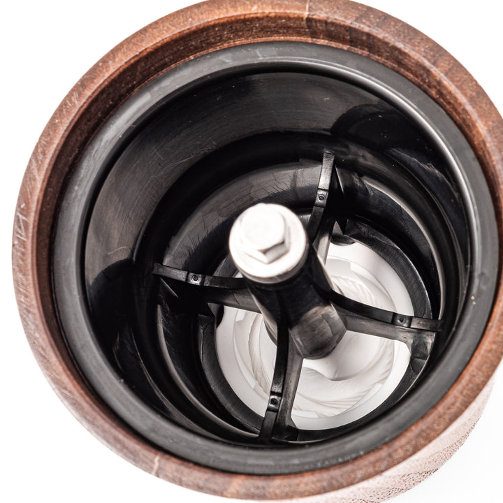 HARIO walnut wood manual coffee grinder with a hand crank, featuring a sleek natural wooden body on a white background