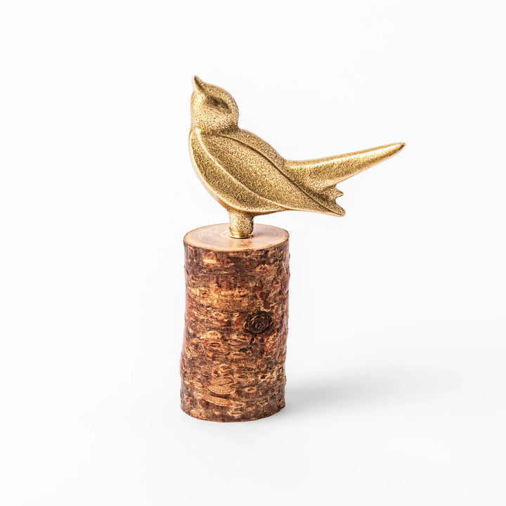 Golden Japanese brass sake cup with rounded base and hammered texture for refined traditional drinking.