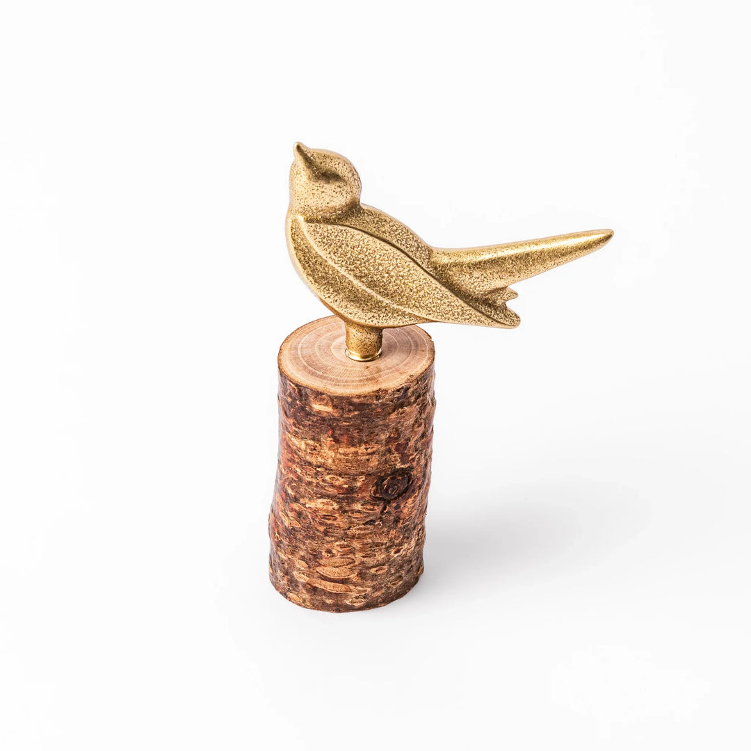 Golden Japanese brass sake cup with rounded base and hammered texture for refined traditional drinking.