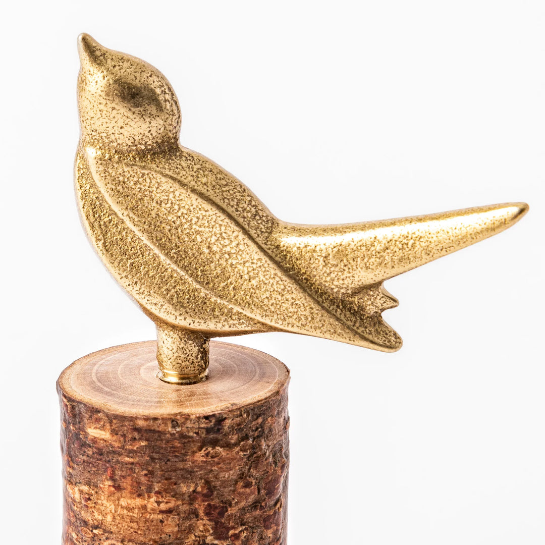 Golden Japanese brass sake cup with rounded base and hammered texture for refined traditional drinking.