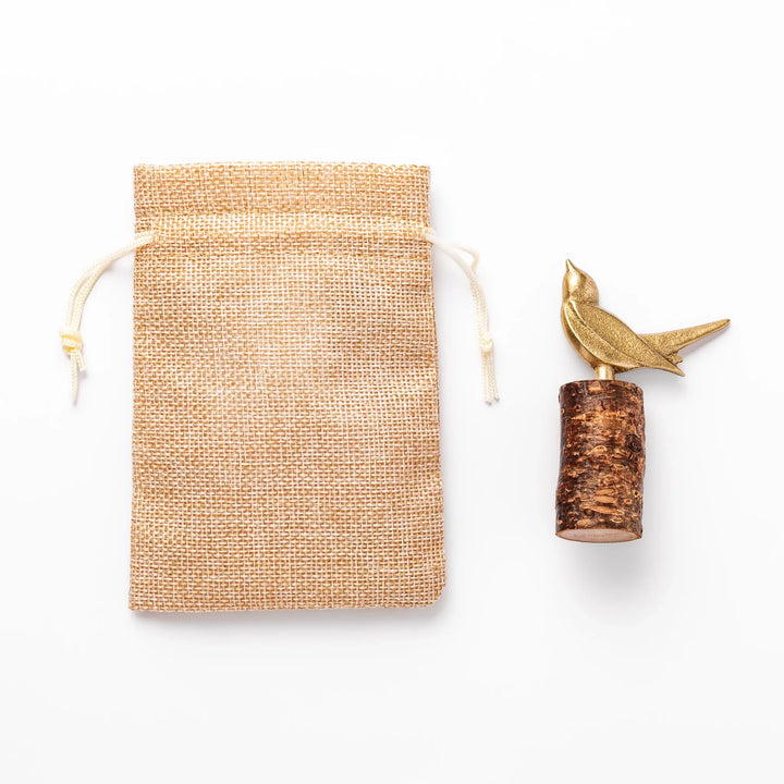 Golden Japanese brass sake cup with rounded base and hammered texture for refined traditional drinking.