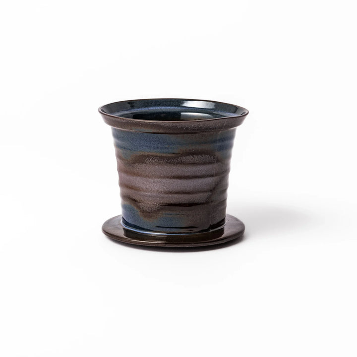 Handcrafted ceramic coffee dripper in earthy brown and blue glaze with detachable fine mesh filter, designed for single-serve brewing.