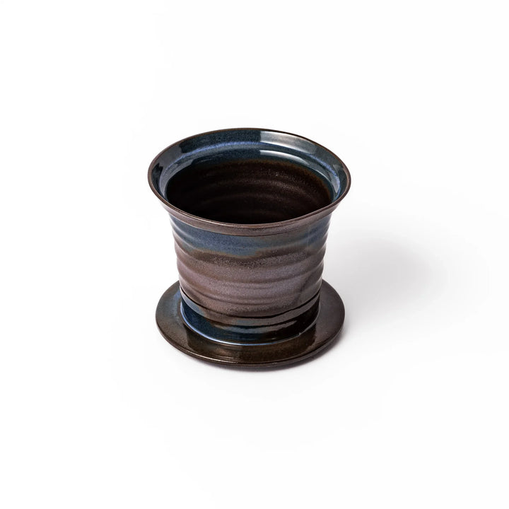 Handcrafted ceramic coffee dripper in earthy brown and blue glaze with detachable fine mesh filter, designed for single-serve brewing.