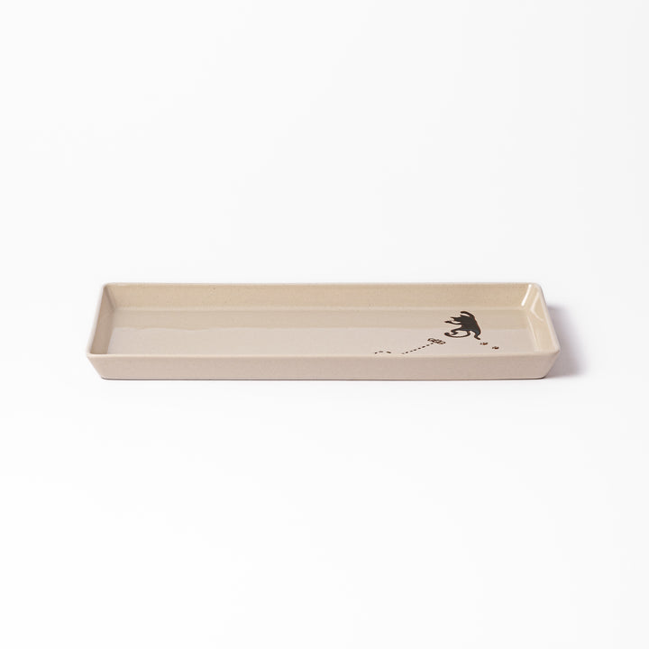Beige rectangular ceramic plate featuring a playful black cat illustration with paw prints and a butterfly in the corner.