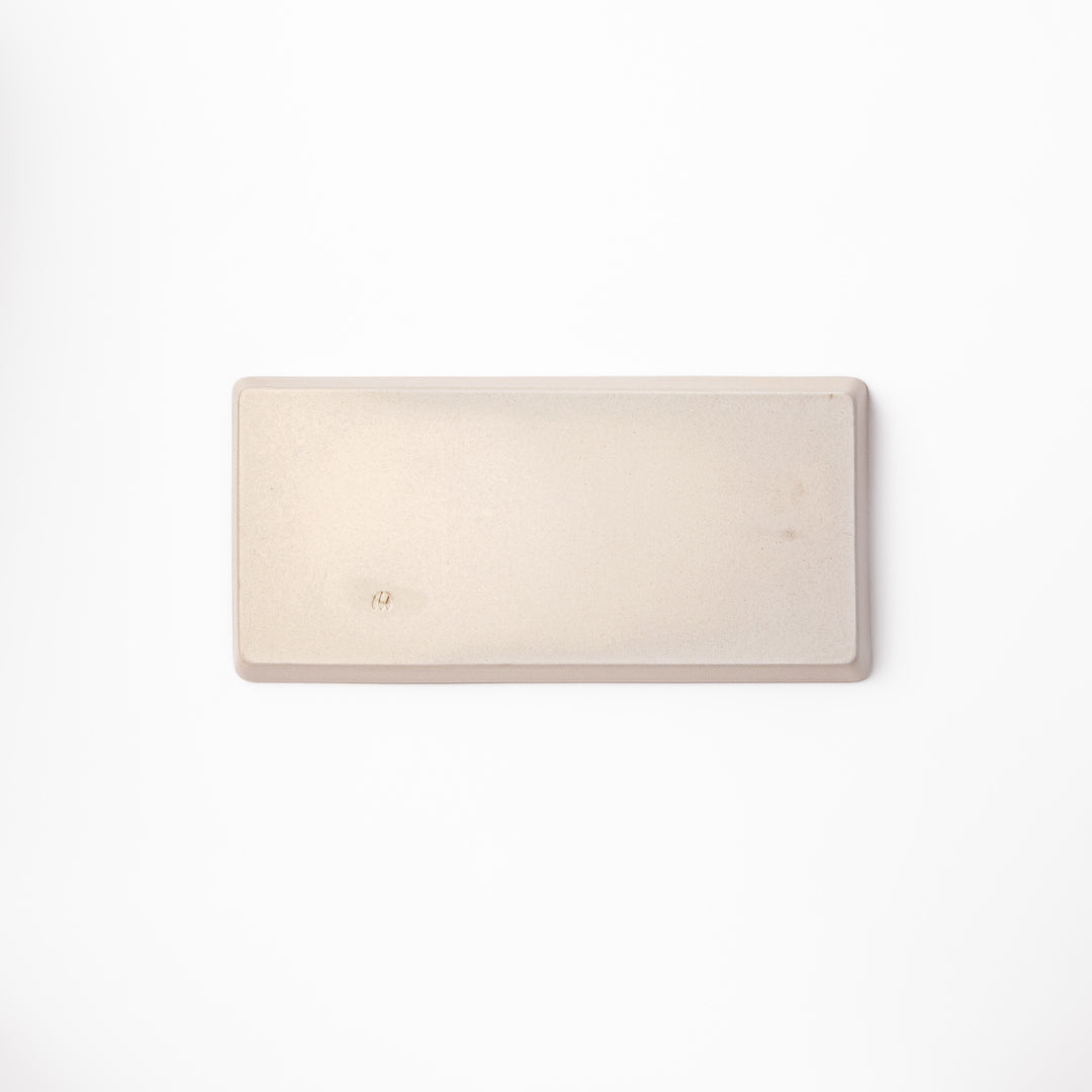 Beige rectangular ceramic plate featuring a playful black cat illustration with paw prints and a butterfly in the corner.