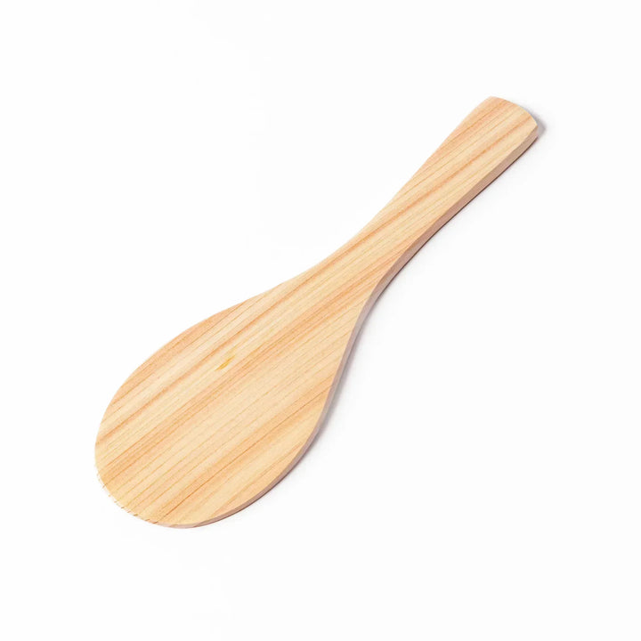 Japanese hinoki wood rice paddle with natural grain and engraved characters, lightweight and smooth for serving cooked rice