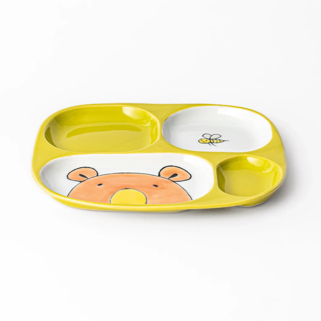 White ceramic kids plate with honey bear face in main section, bee motif in small section, chartreuse accents