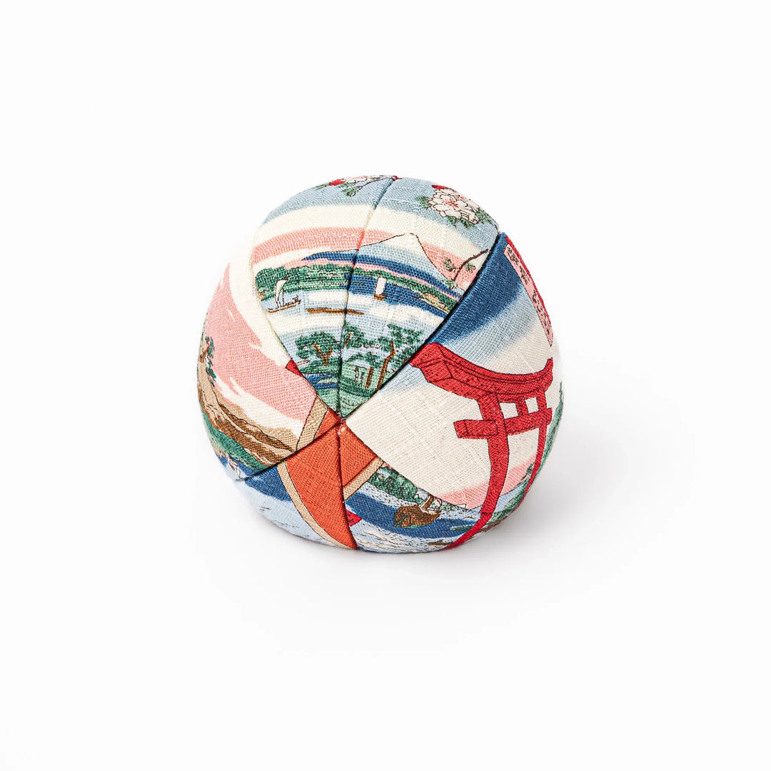 Fabric daruma ornament with bright multicolor kimono pattern and bold painted face