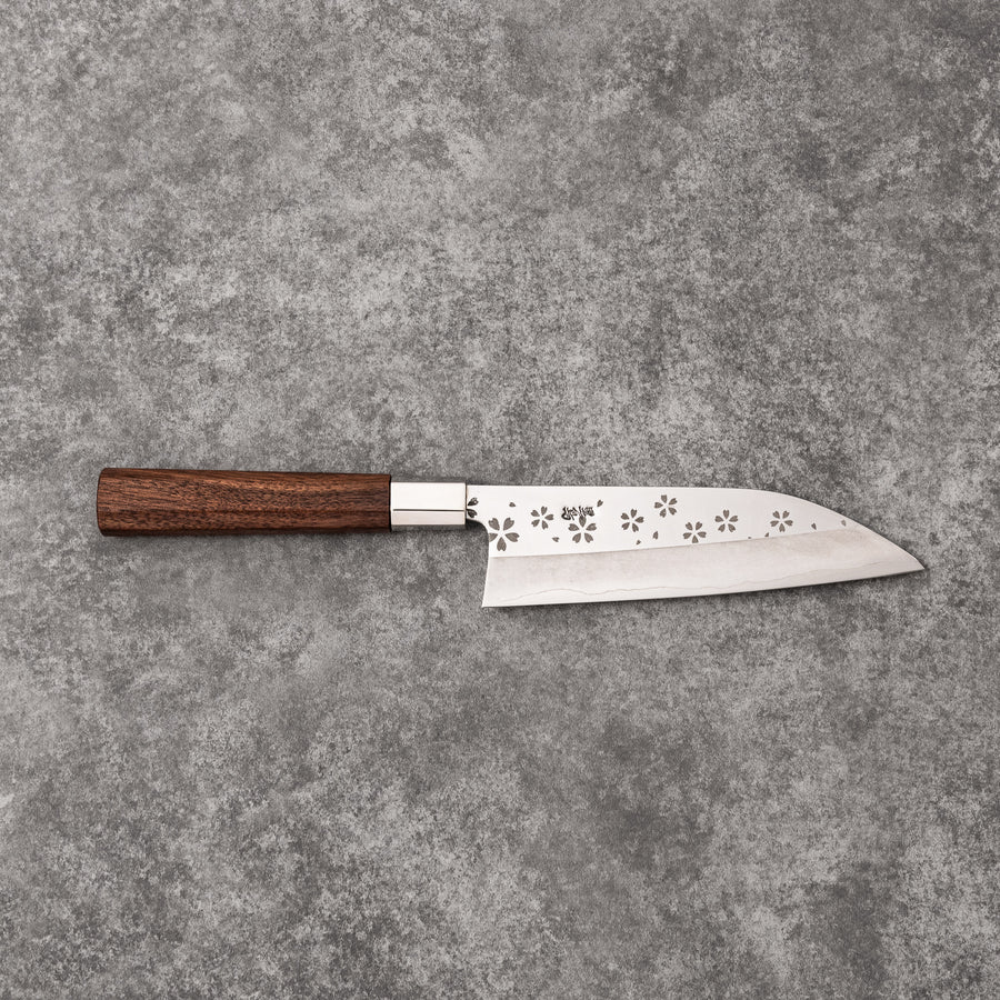 Elegant Japanese kitchen knife with cherry blossom cutout pattern on the blade, featuring a sharp edge and dark wooden handle for precise cutting.