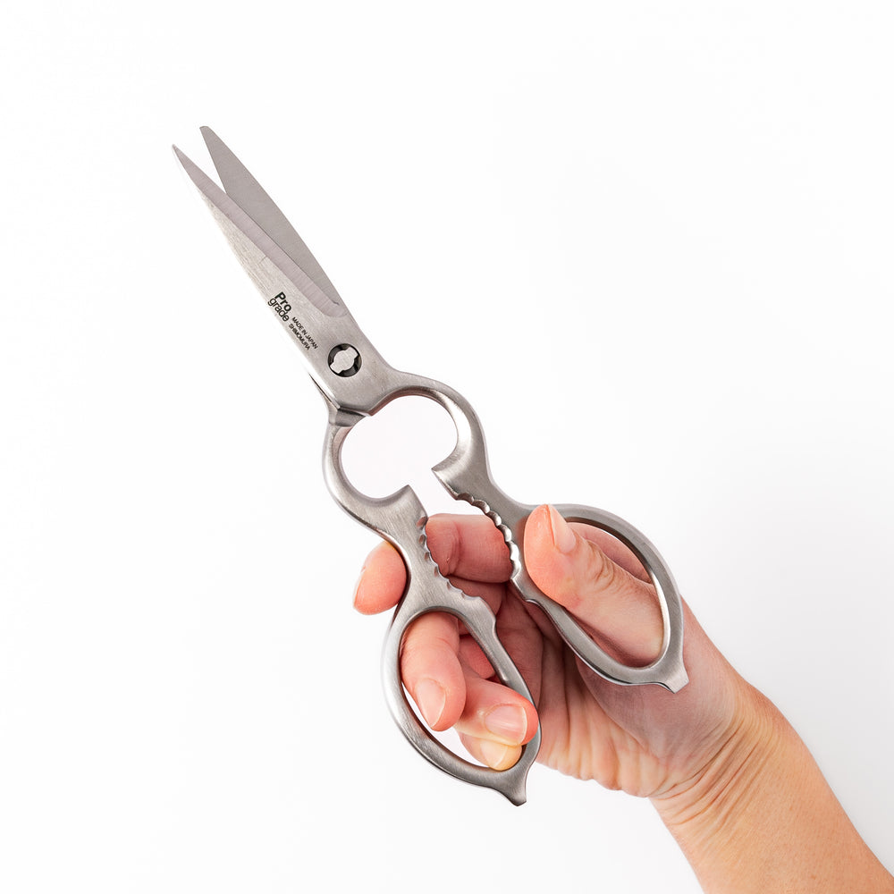 Japanese all-stainless multi-purpose kitchen shears with sharp blades and built-in grip, ideal for cutting meat, seafood, and vegetables with precision and ease.