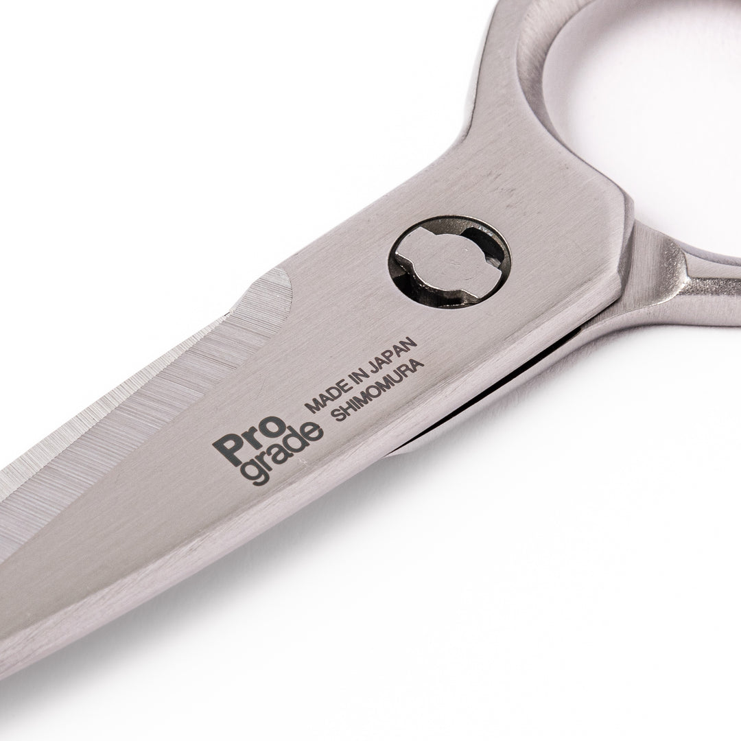 Japanese all-stainless multi-purpose kitchen shears with sharp blades and built-in grip, ideal for cutting meat, seafood, and vegetables with precision and ease.
