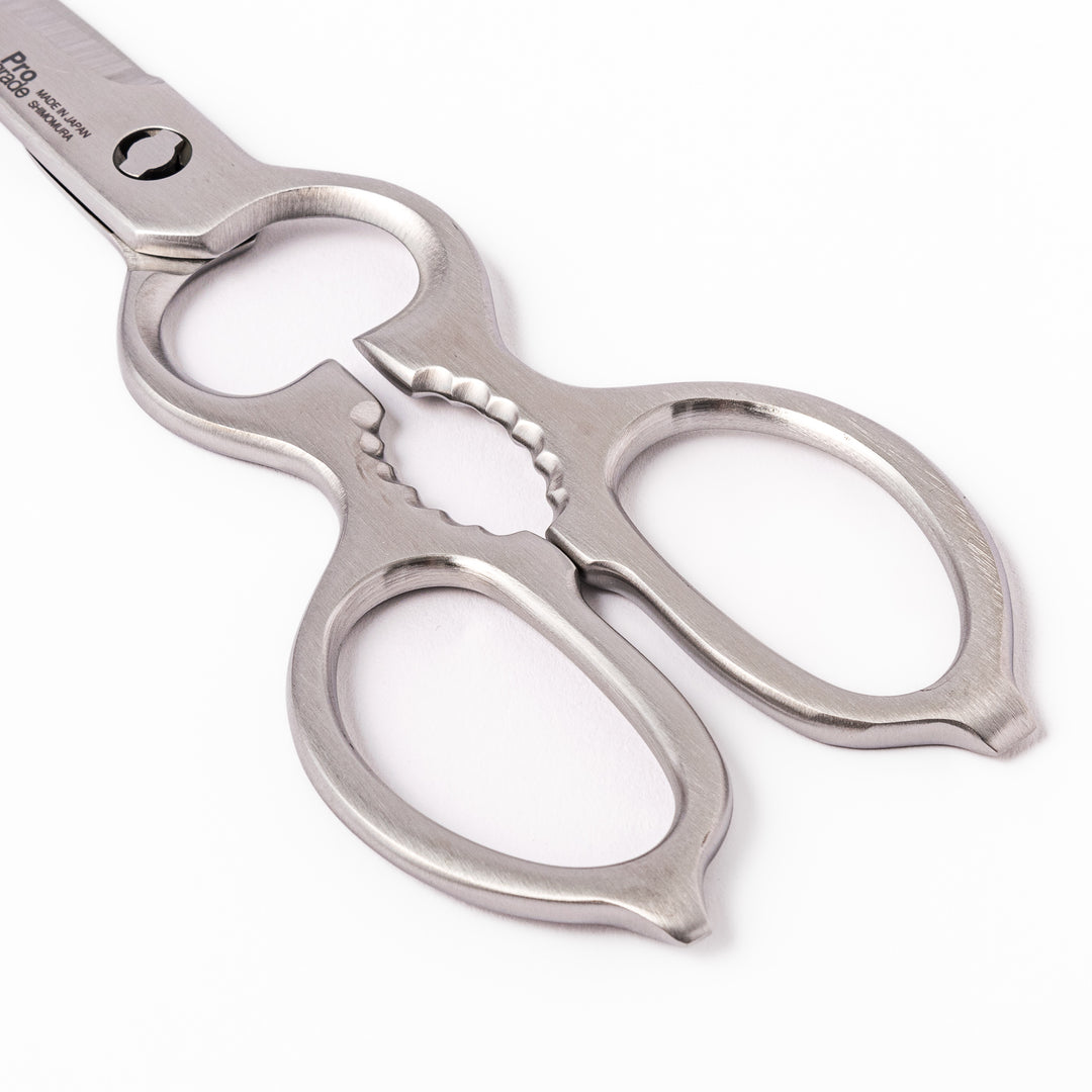 Japanese all-stainless multi-purpose kitchen shears with sharp blades and built-in grip, ideal for cutting meat, seafood, and vegetables with precision and ease.