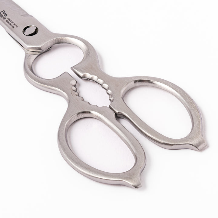 Japanese all-stainless multi-purpose kitchen shears with sharp blades and built-in grip, ideal for cutting meat, seafood, and vegetables with precision and ease.