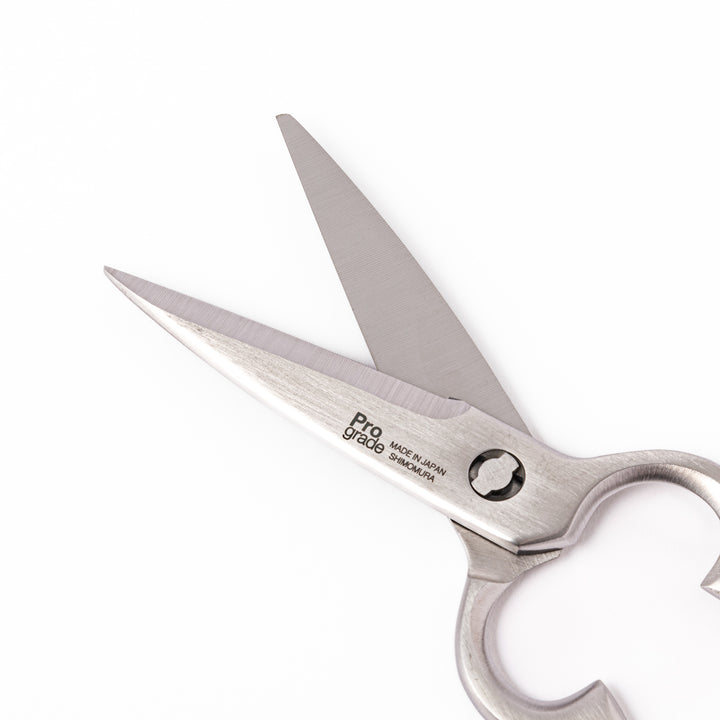 Japanese all-stainless multi-purpose kitchen shears with sharp blades and built-in grip, ideal for cutting meat, seafood, and vegetables with precision and ease.
