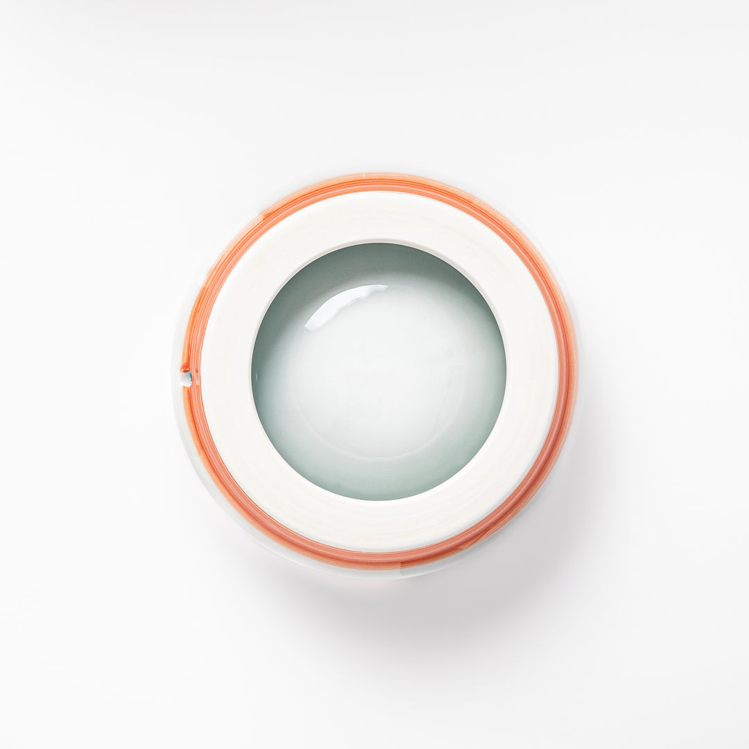 Japanese ceramic dog bowl with hand painted dog face designs and raised rim for pets