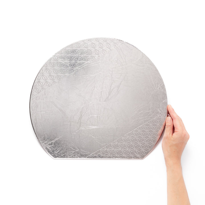 Silver Japanese Asanoha Hemp Leaf Placemat with a semi-circular shape and embossed geometric pattern, perfect for refined modern or traditional table settings.