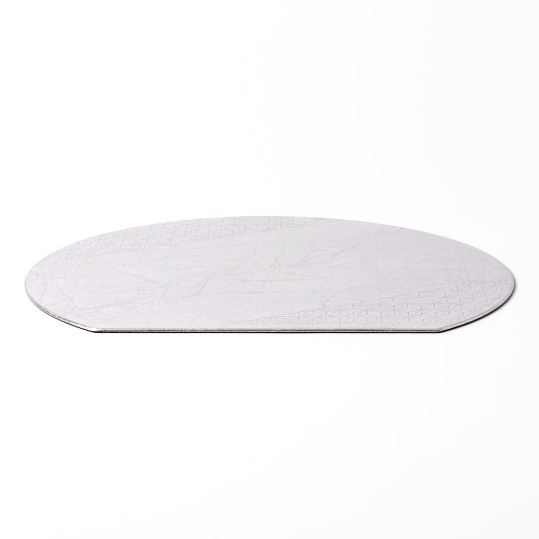 Silver Japanese Asanoha Hemp Leaf Placemat with a semi-circular shape and embossed geometric pattern, perfect for refined modern or traditional table settings.