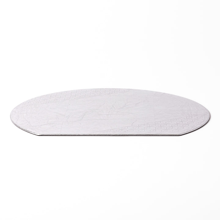Silver Japanese Asanoha Hemp Leaf Placemat with a semi-circular shape and embossed geometric pattern, perfect for refined modern or traditional table settings.