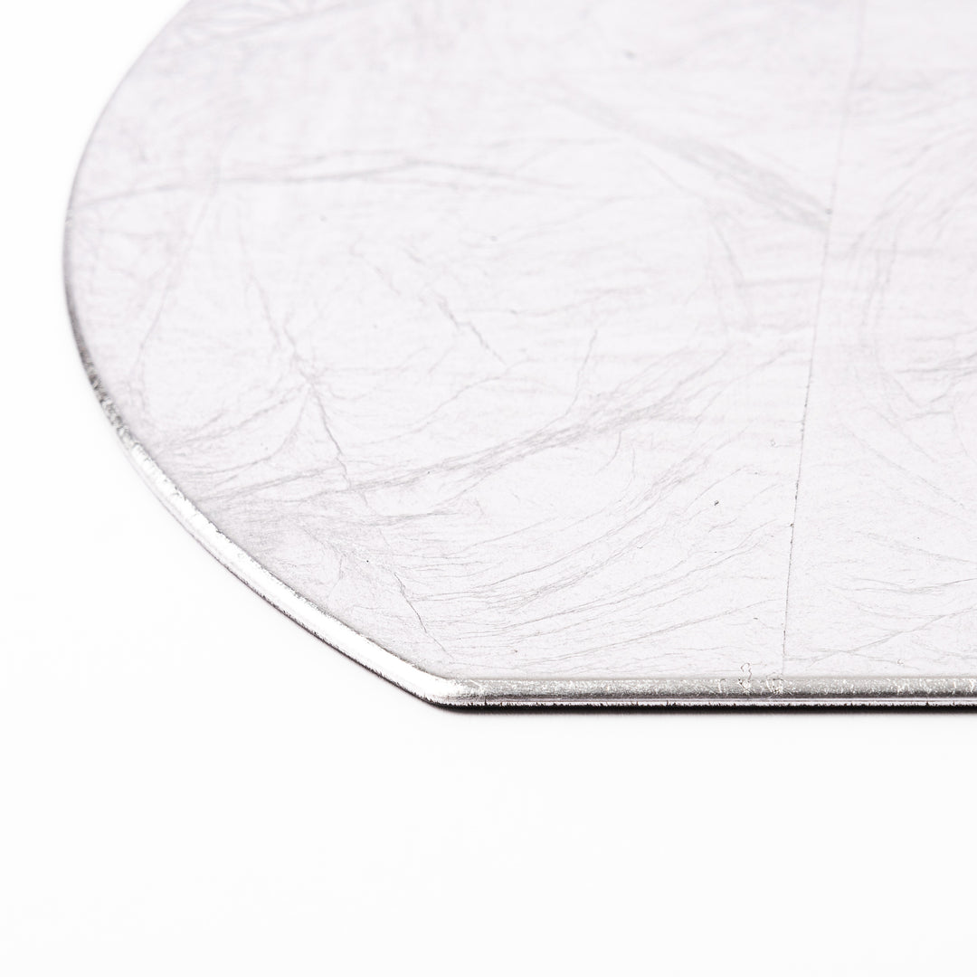 Silver Japanese Asanoha Hemp Leaf Placemat with a semi-circular shape and embossed geometric pattern, perfect for refined modern or traditional table settings.