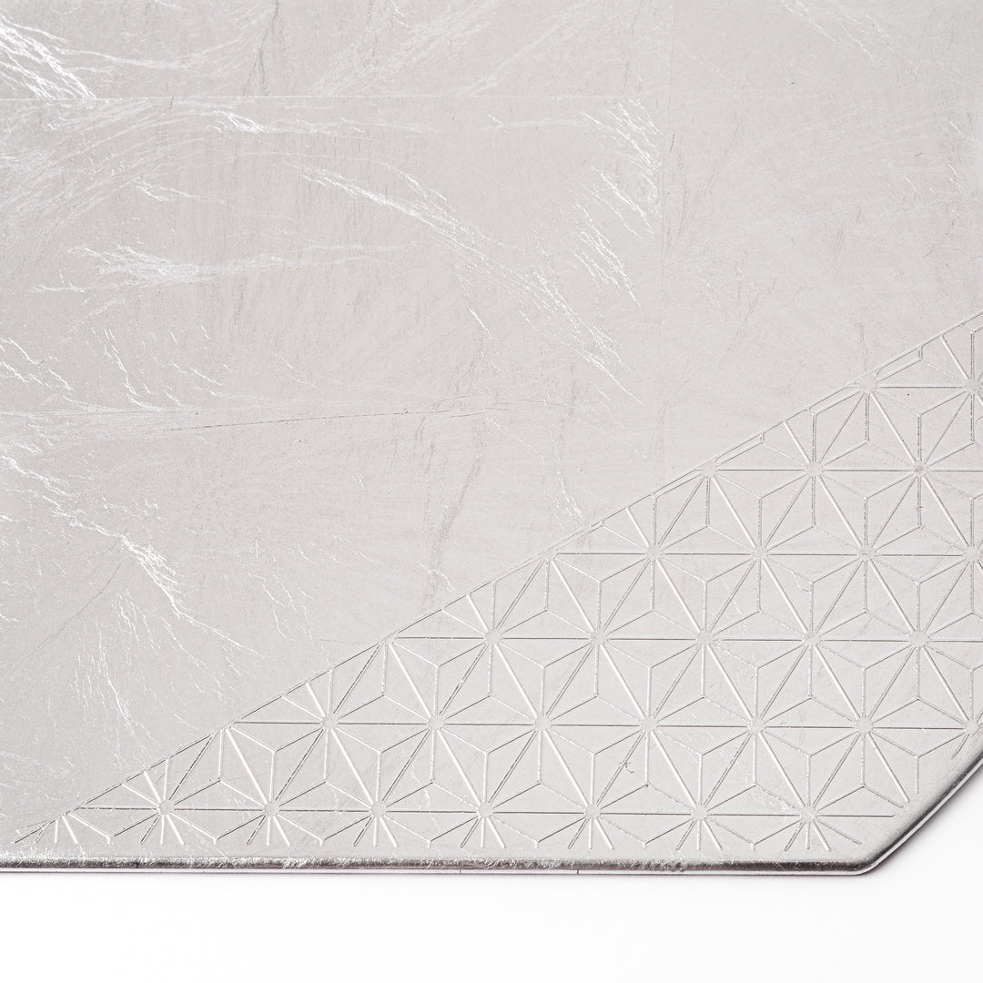 Silver Japanese Asanoha Hemp Leaf Placemat with a semi-circular shape and embossed geometric pattern, perfect for refined modern or traditional table settings.