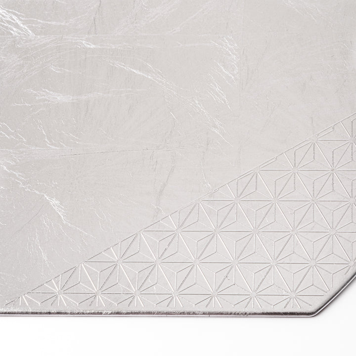 Silver Japanese Asanoha Hemp Leaf Placemat with a semi-circular shape and embossed geometric pattern, perfect for refined modern or traditional table settings.